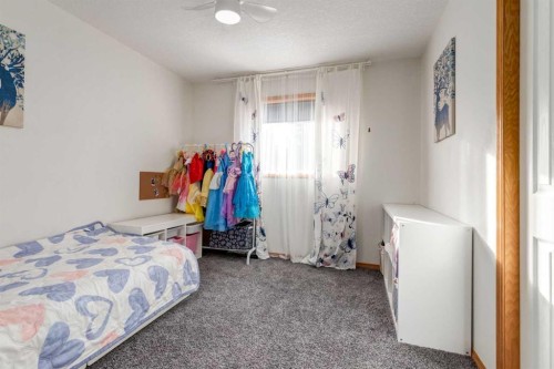 13 Bow Ridge Link, Cochrane, AB - Indoor Photo Showing Bedroom