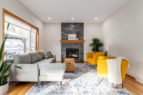 13 Bow Ridge Link, Cochrane, AB - Indoor Photo Showing Living Room With Fireplace