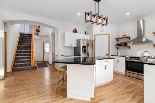 13 Bow Ridge Link, Cochrane, AB - Indoor Photo Showing Kitchen With Upgraded Kitchen