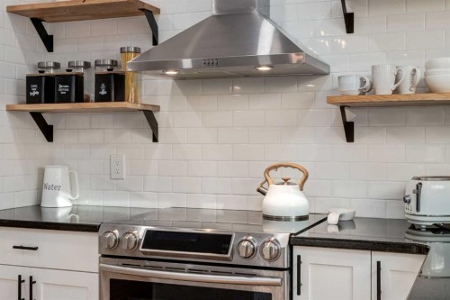 13 Bow Ridge Link, Cochrane, AB - Indoor Photo Showing Kitchen With Upgraded Kitchen