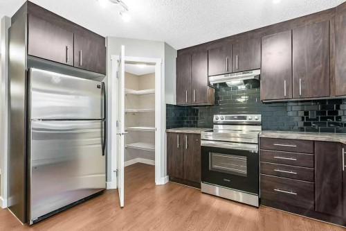 1305-2445 Kingsland Road Se, Airdrie, AB - Indoor Photo Showing Kitchen