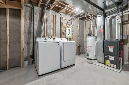 1305-2445 Kingsland Road Se, Airdrie, AB - Indoor Photo Showing Laundry Room