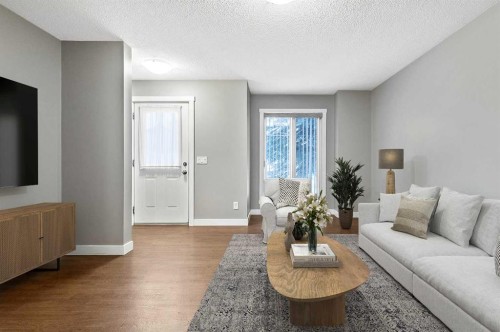 1305-2445 Kingsland Road Se, Airdrie, AB - Indoor Photo Showing Living Room