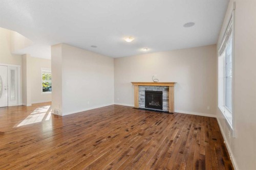 139 Coopers Hill Sw, Airdrie, AB - Indoor Photo Showing Living Room With Fireplace