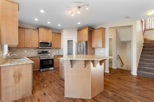 139 Coopers Hill Sw, Airdrie, AB - Indoor Photo Showing Kitchen With Stainless Steel Kitchen With Upgraded Kitchen