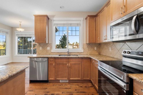 139 Coopers Hill Sw, Airdrie, AB - Indoor Photo Showing Kitchen With Stainless Steel Kitchen With Double Sink