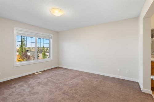 139 Coopers Hill Sw, Airdrie, AB - Indoor Photo Showing Other Room With Fireplace
