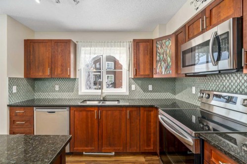2312-279 Copperpond Common Se, Calgary, AB - Indoor Photo Showing Kitchen With Double Sink