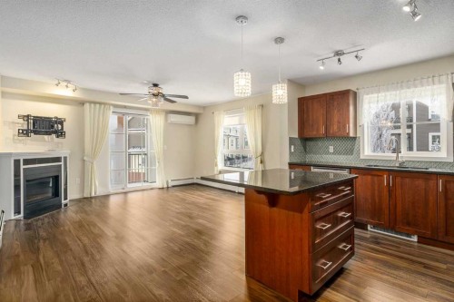 2312-279 Copperpond Common Se, Calgary, AB - Indoor With Fireplace