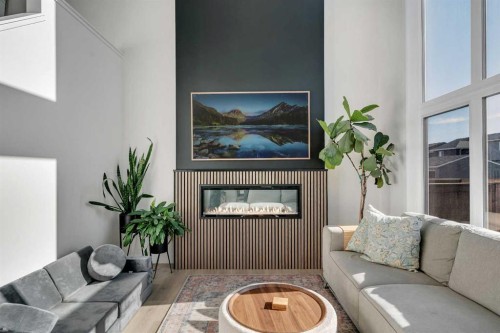 20 Edith Crescent Nw, Calgary, AB - Indoor Photo Showing Living Room With Fireplace