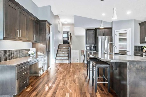 605 Sunrise Close, Diamond Valley, AB - Indoor Photo Showing Kitchen With Stainless Steel Kitchen With Upgraded Kitchen