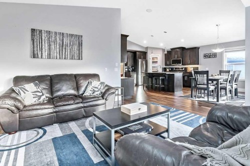 605 Sunrise Close, Diamond Valley, AB - Indoor Photo Showing Living Room