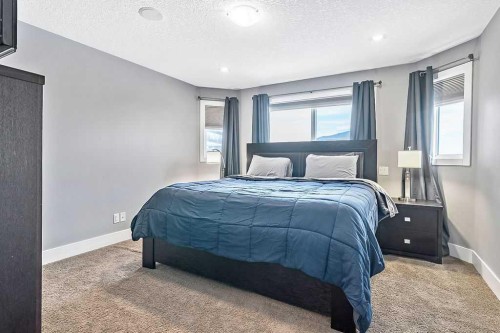 605 Sunrise Close, Diamond Valley, AB - Indoor Photo Showing Bedroom