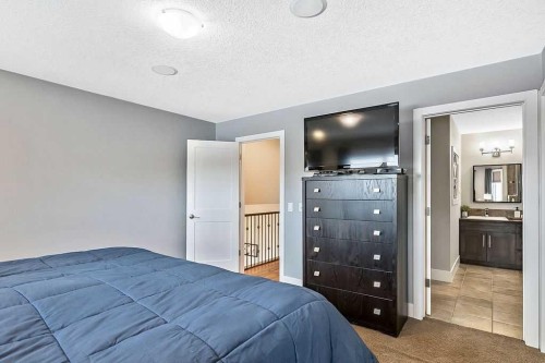 605 Sunrise Close, Diamond Valley, AB - Indoor Photo Showing Bedroom