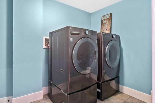 605 Sunrise Close, Diamond Valley, AB - Indoor Photo Showing Laundry Room