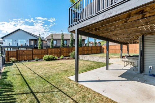 605 Sunrise Close, Diamond Valley, AB - Outdoor With Deck Patio Veranda