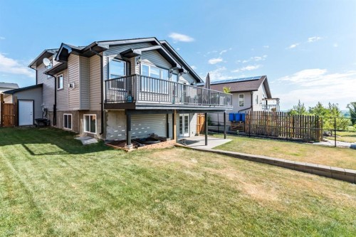 605 Sunrise Close, Diamond Valley, AB - Outdoor With Deck Patio Veranda
