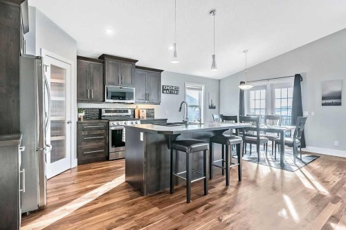 605 Sunrise Close, Diamond Valley, AB - Indoor Photo Showing Kitchen With Stainless Steel Kitchen With Upgraded Kitchen