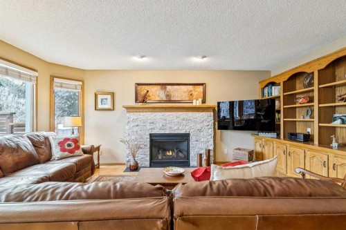75 Shawnee Crescent, Calgary, AB - Indoor Photo Showing Living Room With Fireplace