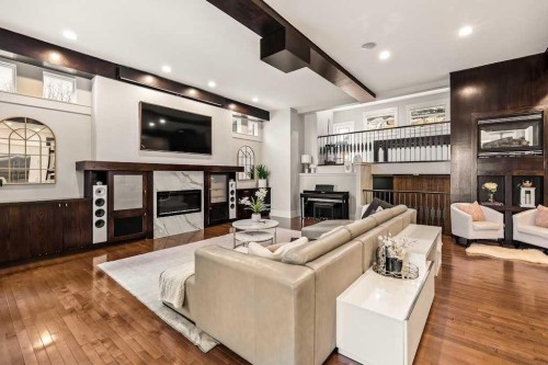 19 Sienna Ridge Bay Sw, Calgary, AB - Indoor Photo Showing Living Room With Fireplace
