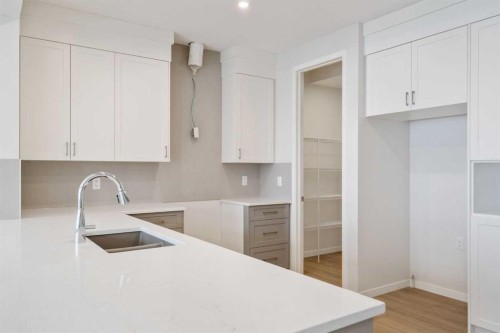19815 44 Street Se, Calgary, AB - Indoor Photo Showing Kitchen With Double Sink