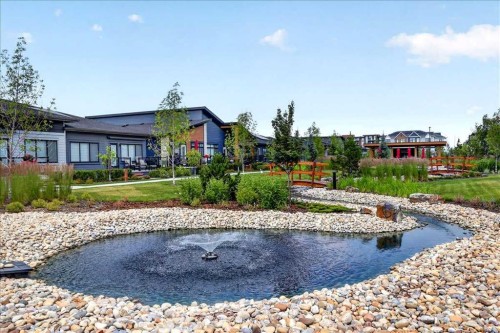 102-140 Marina Cove Se, Calgary, AB - Outdoor With Body Of Water