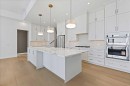 102-140 Marina Cove Se, Calgary, AB  - Indoor Photo Showing Kitchen With Stainless Steel Kitchen With Upgraded Kitchen 
