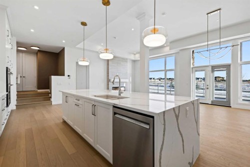 102-140 Marina Cove Se, Calgary, AB - Indoor Photo Showing Kitchen With Double Sink With Upgraded Kitchen