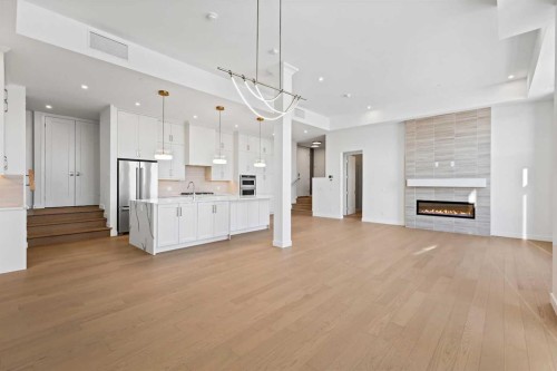 102-140 Marina Cove Se, Calgary, AB - Indoor Photo Showing Other Room With Fireplace