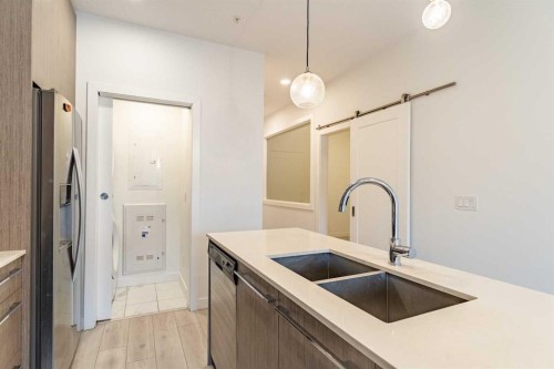 2205-76 Cornerstone Passage Ne, Calgary, AB - Indoor Photo Showing Kitchen With Double Sink