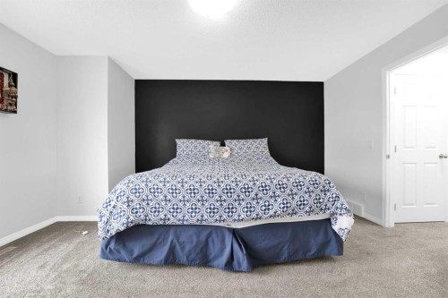 2101 Luxstone Boulevard Sw, Airdrie, AB - Indoor Photo Showing Bedroom