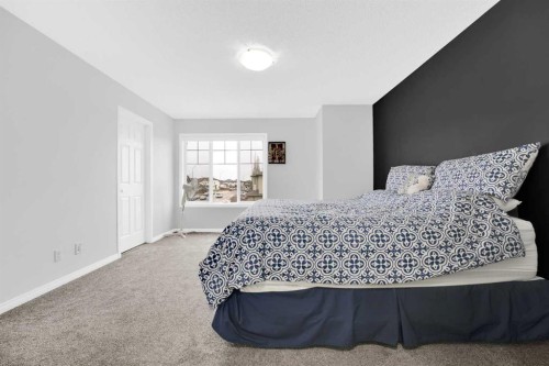 2101 Luxstone Boulevard Sw, Airdrie, AB - Indoor Photo Showing Bedroom