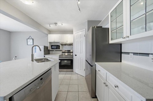 64 Macewan Park Rise Nw, Calgary, AB - Indoor Photo Showing Kitchen With Double Sink