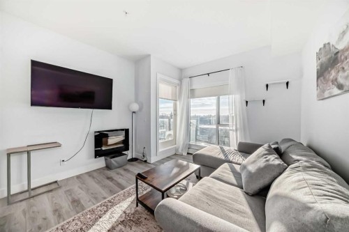 304-1521 26 Avenue Sw, Calgary, AB - Indoor Photo Showing Living Room With Fireplace