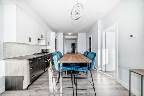 304-1521 26 Avenue Sw, Calgary, AB - Indoor Photo Showing Dining Room