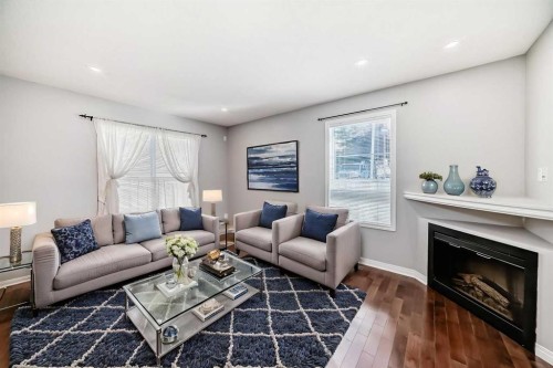 95 Hidden Creek Rise Nw, Calgary, AB - Indoor Photo Showing Living Room With Fireplace