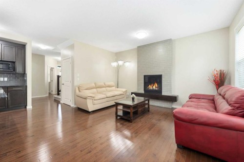 72 Walden Heights Se, Calgary, AB - Indoor Photo Showing Living Room With Fireplace