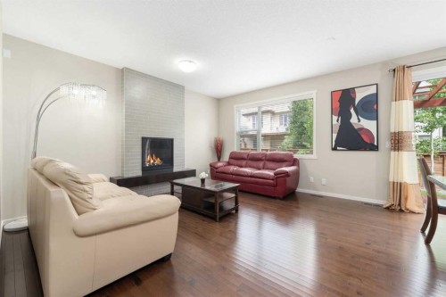 72 Walden Heights Se, Calgary, AB - Indoor Photo Showing Living Room With Fireplace