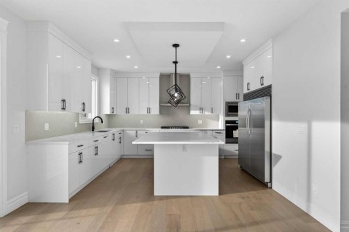 98 Waterford Crescent, Chestermere, AB - Indoor Photo Showing Kitchen With Upgraded Kitchen