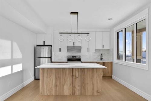 98 Waterford Crescent, Chestermere, AB - Indoor Photo Showing Kitchen With Upgraded Kitchen