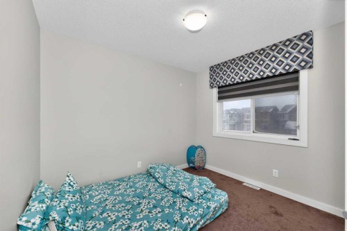 1072 Cornerstone Street Ne, Calgary, AB - Indoor Photo Showing Bedroom