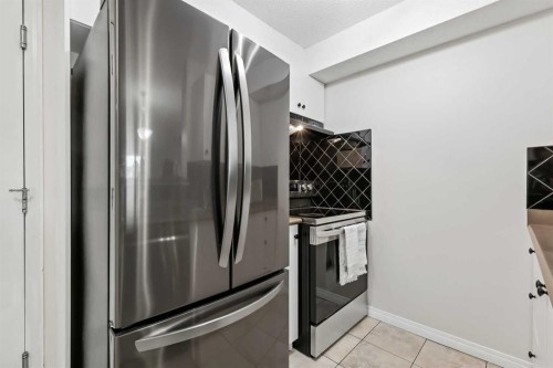 1208-2395 Eversyde Avenue Sw, Calgary, AB - Indoor Photo Showing Kitchen With Stainless Steel Kitchen
