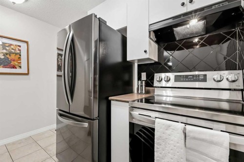 1208-2395 Eversyde Avenue Sw, Calgary, AB - Indoor Photo Showing Kitchen With Stainless Steel Kitchen