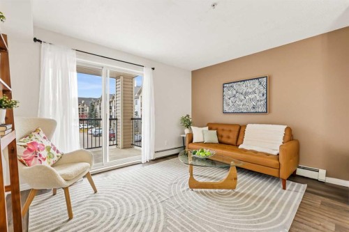1208-2395 Eversyde Avenue Sw, Calgary, AB - Indoor Photo Showing Living Room