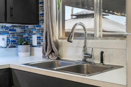48 Marbank Place Ne, Calgary, AB - Indoor Photo Showing Kitchen With Double Sink