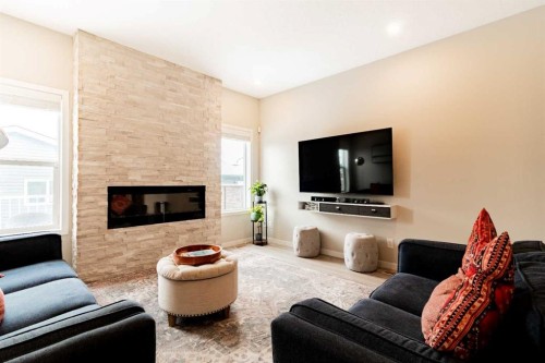 178 Livingston Avenue Ne, Calgary, AB - Indoor Photo Showing Living Room With Fireplace