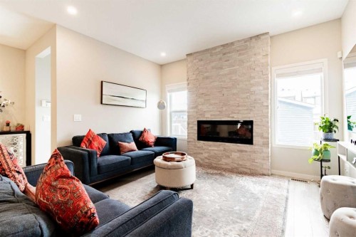 178 Livingston Avenue Ne, Calgary, AB - Indoor Photo Showing Living Room With Fireplace