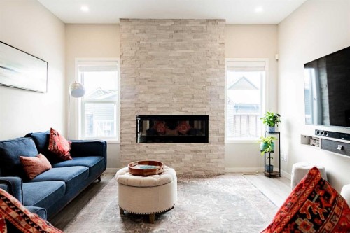 178 Livingston Avenue Ne, Calgary, AB - Indoor Photo Showing Living Room With Fireplace