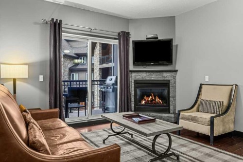 322-901 Mountain Street, Canmore, AB - Indoor Photo Showing Living Room With Fireplace