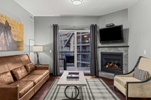322-901 Mountain Street, Canmore, AB - Indoor Photo Showing Living Room With Fireplace